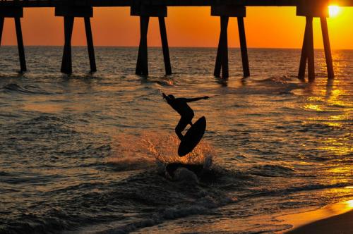 Skimboarder at Sunset in Panama City Beach