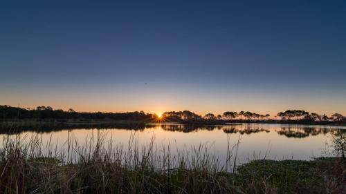 Sunrise, Gator Lake, St. Andrews State Park.  ©2015 Kevin Novak.